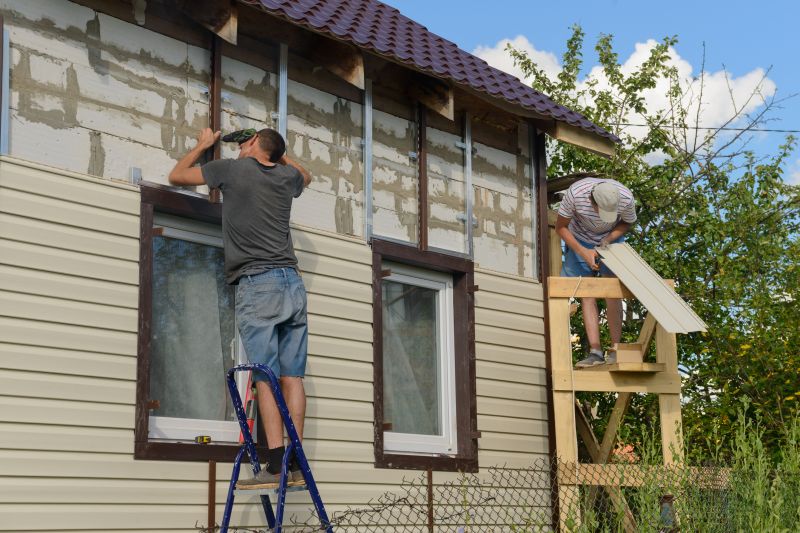 Vinyl siding installation in progress